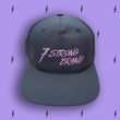 Load image into Gallery viewer, Centered close up of the black 7-Strong script logo hat. The hat is featured a deep lavender background with black 7-bolts patterned throughout.