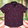 Load image into Gallery viewer, Full centered view of the 7-Strong "Wingman" shirt, featuring various different flat and drum chicken wings and dip sauces on a deep blue background. Shirt is featured against a picnic/park background.