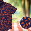 Load image into Gallery viewer, 3/4 view of the 7-Strong "Wingman" shirt, featuring various different flat and drum chicken wings and dip sauces on a deep blue background. Shirt is featured against a picnic/park background. Bottom right corner features a detail circle showing the design in close up.