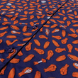 Load image into Gallery viewer, Close up midsection view of the 7-Strong "Wingman" shirt, featuring various different flat and drum chicken wings and dip sauces on a deep blue background. Shirt is featured against a picnic/park background.
