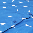 Load image into Gallery viewer, A midsection button view of the adult 7-Strong "Paper Planes" button down shirt - featuring various sizes and designs of paper airplanes, some with dotted trails behind them against a royal blue background. The shirt is displayed against a faced background of the shirt details.