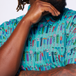 Load image into Gallery viewer, Middle shoulders and chest view male model, hand up contemplating, wearing the 7-Strong adult "I'd Tap That" shirt - in a bright seafoam green color, the shirt features rows of custom beer tap handles modeled after previous 7-Strong designs.