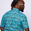 Load image into Gallery viewer, Medium shot of a male model, back turned, head to the side wearing the 7-Strong adult "I'd Tap That" shirt - in a bright seafoam green color, the shirt features rows of custom beer tap handles modeled after previous 7-Strong designs.