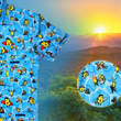 Load image into Gallery viewer, 3/4 close up view of the 7-Strong Avocado Coast button down featuring various avocado characters engaging in summer activities such as grilling, playing volleyball, weightlifting, surfing, etc against a blue shimmery wave looking background. The shirt is displayed on a coastal rainforest background. The bottom right features a detail circle showing some of the avocado icons in better detail.