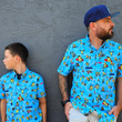 Load image into Gallery viewer, Male youth and male adult models wearing the 7-Strong Avocado Coast button down, against a gray stone wall looking away from camera and in opposite directions.