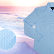 Load image into Gallery viewer, Close up mid button view of the baby blue long sleeve EveryWEAR adult button up. Pattern is subtle white 7-Bolts lined up all against each other across a baby blue background. The shirt is featured on a soft background of a wave hitting the beach. Bottom left corner features a detail circle showing close ups of the subtle 7-bolts on the shirt.