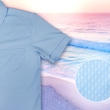 Load image into Gallery viewer, 3/4 full view of the baby blue short sleeve EveryWEAR adult button up. Pattern is subtle white 7-Bolts lined up all against each other across a baby blue background. The shirt is featured on a soft background of a wave hitting the beach. Bottom right corner features a detail circle of the bolts up close.