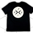 Load image into Gallery viewer, Centered full view of the back of the 7-Strong black Branded tee, featuring the X-Brand patch logo centered in white. Shirt is featured against a white geometric background.