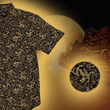 Load image into Gallery viewer, Black shirt with gold dragon pattern on a dark background against a cityscape