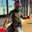 Load image into Gallery viewer, Person wearing a helmet and gloves and the 7-Strong Bruce Leroy golden dragon button down, standing on a sidewalk with a building in the background