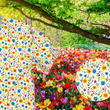 Load image into Gallery viewer, A 3/4 close-up shot of the 7-Strong "Daisy Me Rollin'" adult button down shirt, a white base color with various blue, red, orange, and yellow floral daisies in an all over print. The shirt is displayed against a background of a field of daisies. The bottom right features a detail circle with a close up of the shirt design.