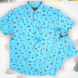 Load image into Gallery viewer, A full, centered, overlapping view of the youth and adult 8-Bit Hat Trick button down - featuring various 8-bit inspired scenes from hockey games on a light blue ice-like background. The shirt is featured against a ice hockey floor with hats strewn about.