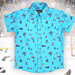 Load image into Gallery viewer, A full, centered view of the youth 8-Bit Hat Trick button down - featuring various 8-bit inspired scenes from hockey games on a light blue ice-like background. The shirt is featured against a ice hockey floor with hats strewn about.