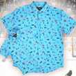 Load image into Gallery viewer, A full, centered, overlapping view of the youth and adult 8-Bit Hat Trick button down - featuring various 8-bit inspired scenes from hockey games on a light blue ice-like background. The shirt is featured against a ice hockey floor with hats strewn about.