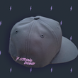 Load image into Gallery viewer, Centered close up of the side of the black 7-Strong 7-bolt logo hat featuring a 7-Strong script logo in lavender and solid back. The hat is featured a slate background with lavender 7-bolts patterned throughout.