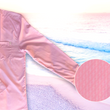 Load image into Gallery viewer, 3/4 full view of the pink long sleeve EveryWEAR adult button up. Pattern is subtle white 7-Bolts lined up all against each other across a pink background. The shirt is featured on a soft background of a wave hitting the beach. Bottom right corner features a detail circle of the bolts up close.