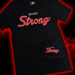 Load image into Gallery viewer, Full centered look at the Black 7-Strong Sideline Script hat, with white embroidered SEVEN and red puff scripted STRONG across the front. Hat is laid on top of the 7-Strong Sideline Script tee with same printed design. Both are featured on a red and black fusion background.