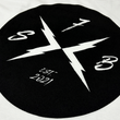 Load image into Gallery viewer, Close up back shoulder look of the 7-Strong white Branded tee, featuring the X-Brand patch logo centered in black. Shirt is featured against a white geometric background.
