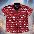 Load image into Gallery viewer, A full, centered view of the 7-Strong youth "Smoke Show" button up, a deep maroon red colored shirt with rows of various barbecue and cookout related items and delicacies silhouetted in white. The shirt is displayed against a background of a brisket being pulled.