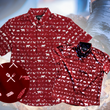 Load image into Gallery viewer, A full view of the 7-Strong youth and adult "Smoke Show" button ups overlapping one another, a deep maroon red colored shirt with rows of various barbecue and cookout related items and delicacies silhouetted in white.The shirt is displayed against a background of a brisket being pulled. The bottom left features a detail circle showing a close-up of elements in the design.