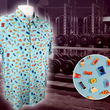 Load image into Gallery viewer, Full view of the 7-Strong "Cheat Day" adult button down featuring various snacks, treats, and fast food features on a light blue shirt. The shirt is displayed against a background of a gym weight rack. Bottom right corner has a close up detail circle showing some of the design features upclose.