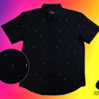Load image into Gallery viewer, Full view of short sleeve adult button down shirt, black as base color and adorned with multicolored version of our 7-Bolt design. Shirt is on a multicolor gradient-like background, in the left corner there is a circled out close up of the colored 7-bolts and on the bottom right, the logo for onePULSE Foundation, our cause collection partner.