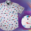 Load image into Gallery viewer, Full view of the 7-Strong Block Party adult button down, featuring various colored blocks of different arrangements inspired by a classic video game, cascading down the shirt against a grayish background featuring shadows of the same shapes. The shirt is presented on a background of similar design.In the bottom right is a detail circle with a close up of the design.