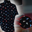 Load image into Gallery viewer, Full view of the adult short sleeve version of "Got 'Em!" The button down features various athletic fashion sneakers in an 8-bit format arranged all over a black shirt. The shirt is featured against a background of a basketball player on the court, noticeable sneakers being worn. Bottom right corner features a detail circle showing the various shoes up close.
