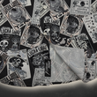 Load image into Gallery viewer, Bottom sweep tag view of the adult 7-Strong "Cinco de Mayhem" button down shirt. Shirt features black and white posters featuring various created luchadors advertised for matches, all overlapping each other over a black shirt. Shirt is displayed on a black gradient background with some of the characters ghosted in the back.