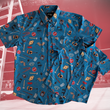 Load image into Gallery viewer, Full view of overlapping adult and youth 7-Strong "TLC OMG" shirt, a homage to wrestling objects featured all over the shirt including tables, ladders, chairs, ring bells, sledgehammers, brass knuckles, championships, guitars, stop signs, microphones amongst other items. The items are on a blue shirt with a faded steel cage background. The shirt is featured on a background of a wrestling ring with a standing ladder.