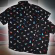 Load image into Gallery viewer, Full view of the adult and youth short sleeve versions of "Got 'Em!," overlapping one another. The button down features various athletic fashion sneakers in an 8-bit format arranged all over a black shirt. The shirt is featured against a background of a basketball player on the court, noticeable sneakers being worn