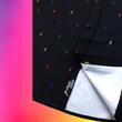 Load image into Gallery viewer, Close up, focusing on sweep tag portion of long sleeve adult button down shirt, black as base color and adorned with multicolored version of our 7-Bolt design. Shirt is on a multicolor gradient-like background, and on along the side left, the logo for onePULSE Foundation, our cause collection partner.