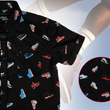 Load image into Gallery viewer, 3/4 view of the youth short sleeve version of "Got 'Em!" The button down features various athletic fashion sneakers in an 80bit format arranged all over a black shirt. The shirt is featured against a background of a basketball player jumping in air, noticeable sneakers being worn. Bottom right corner features a detail circle showing the various shoes up close.