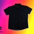 Load image into Gallery viewer, Full view of youth short sleeve button down shirt, black as base color and adorned with multicolored version of our 7-Bolt design. Shirt is on a multicolor gradient-like background, in the bottom left, the logo for onePULSE Foundation, our cause collection partner.