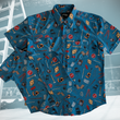 Load image into Gallery viewer, Full view of overlapping adult and youth 7-Strong "TLC OMG" shirt, a homage to wrestling objects featured all over the shirt including tables, ladders, chairs, ring bells, sledgehammers, brass knuckles, championships, guitars, stop signs, microphones amongst other items. The items are on a blue shirt with a faded steel cage background. The shirt is featured on a background of a wrestling ring with a standing ladder.