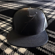 Load image into Gallery viewer, 7-Series Trucker Hat: Black on Black
