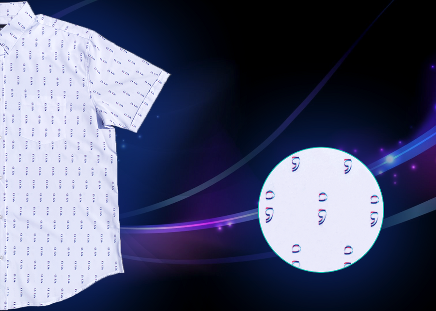 A 1/2 view of the 7-Strong "Stay" button down, a white shirt with staggered, hollowed out semicolons outlined in teal and purple - the colors for suicide awareness. The shirt is on a purple and teal wispy, illuminated background. The bottom left features a detail circle showing the shirt design icons up close. 