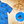 Load image into Gallery viewer, A 3/4 view of the 7-Strong &quot;7-Seas&quot; shirt, a bright blue colored shirt with various nautical depictions such as islands, ships, mermaids, etc - drawn in a treasure map like fashion. The shirt is displayed against a weathered treasure map and compass background. The bottom right features a detail circle highlighting one of the drawings on the shirt. 
