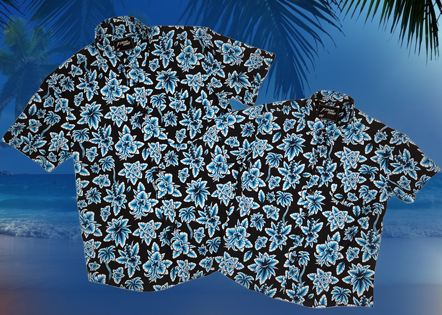 Overlapping full view of the 7-Strong adult and youth Electric Palms shirt, a collection of electric blue palm fronds featured against a black shirt. Shirt is displayed against a scenic beach background. 
