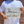 Load image into Gallery viewer, A midsection view of a male model wearing the 7-Strong &quot;Stay&quot; button down, a white shirt with staggered, hollowed out semicolons outlined in teal and purple - the colors for suicide awareness. Model is holding a handwritten sign saying &quot;You Are Not Alone.&quot;
