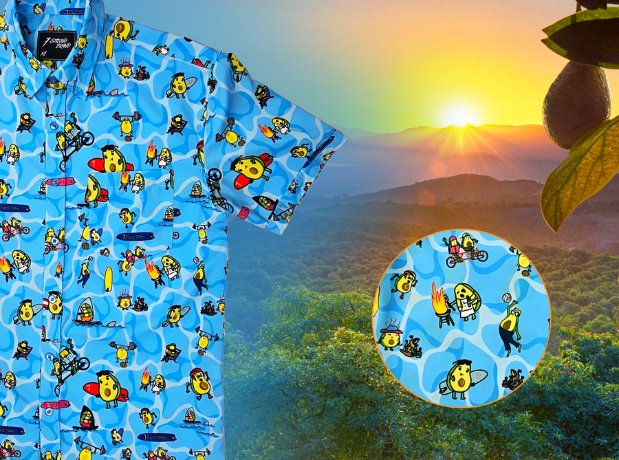 3/4 close up view of the 7-Strong Avocado Coast button down featuring various avocado characters engaging in summer activities such as grilling, playing volleyball, weightlifting, surfing, etc against a blue shimmery wave looking background. The shirt is displayed on a coastal rainforest background. The bottom right features a detail circle showing some of the avocado icons in better detail. 