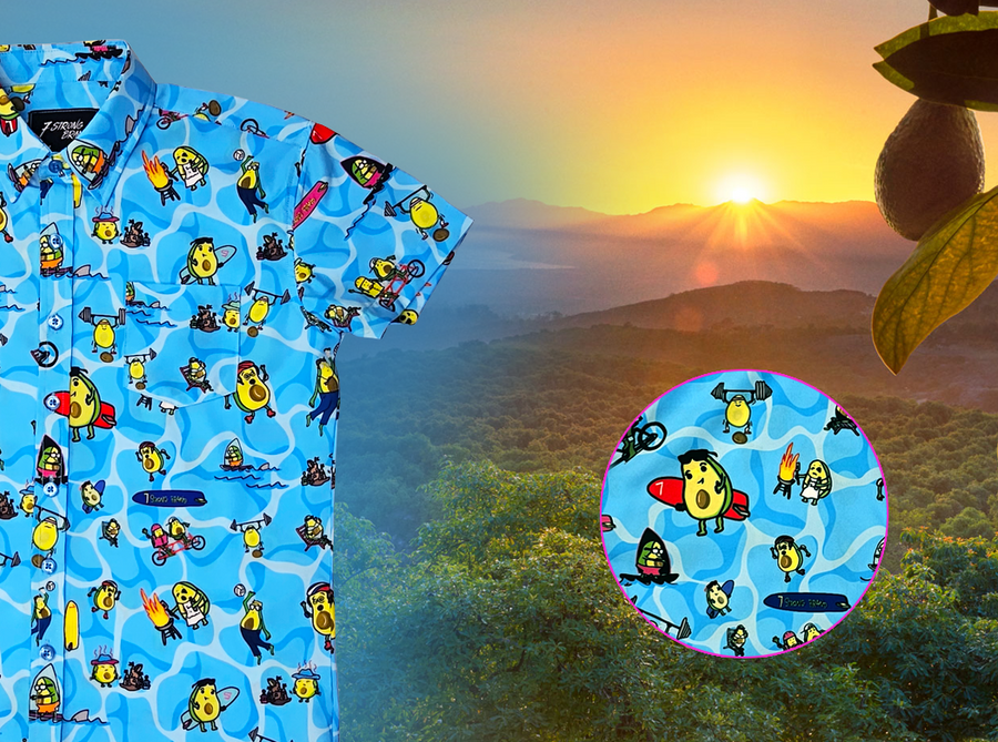 3/4 close up view of the 7-Strong Avocado Coast button down featuring various avocado characters engaging in summer activities such as grilling, playing volleyball, weightlifting, surfing, etc against a blue shimmery wave looking background. The shirt is displayed on a coastal rainforest background. The bottom right features a detail circle showing some of the avocado icons in better detail. 