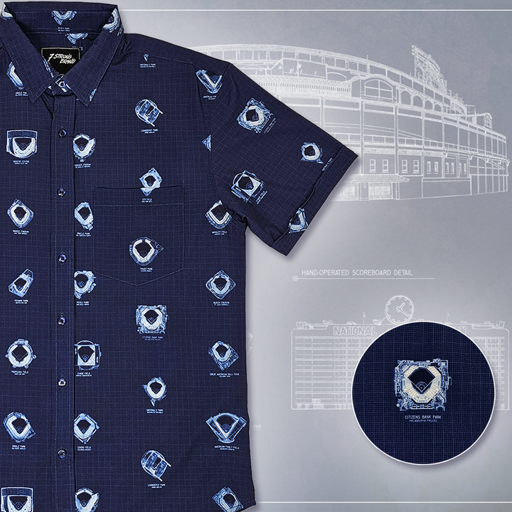 7-Strong's adult Ballpark Blueprints shirt, featuring overhead maps of all the major league stadiums, left justified against a background of one of the drawn maps. Bottom right features a detail circle of one of the stadium designs. 