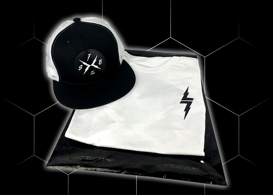 Folded and centered close up of the 7-Strong white Branded tee, featuring a 7-bolt logo left justifed in white. It is paired with the black "Branded" trucker hat with raised x-badge patch. Shirt is featured against a black geometric background.