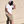 Load image into Gallery viewer, Male model, justified center of frame against a beige wall wearing the 7-Strong white &quot;Branded&quot; Tee and black 7-Strong &quot;Branded&quot; trucker hat, with raised X-Badge in black on the front. Model is looking down and away from camera.
