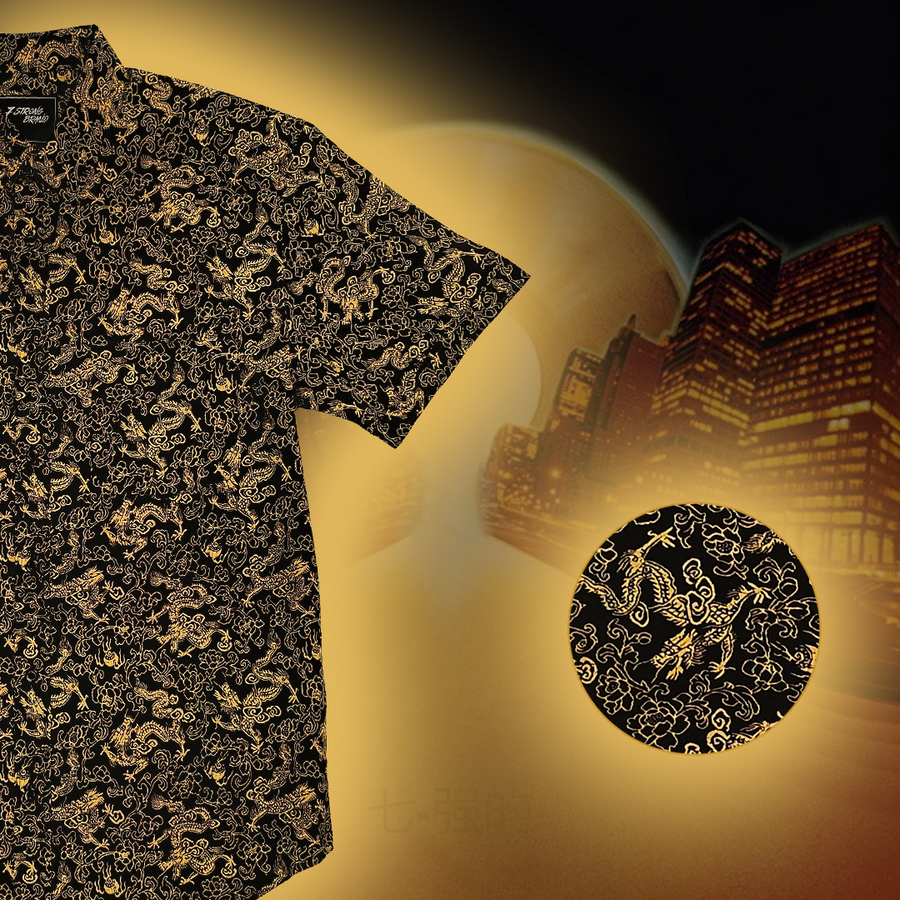 Black shirt with gold dragon pattern on a dark background against a cityscape
