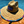 Load image into Gallery viewer, Centered close up of the 7-Strong &quot;Neon Coast&quot; Sun Hat, made from straw, which features the Neon Coast design in a patch on the front, with &quot;7-Strong Brand&quot; written across it. The pattern can also be seen lining the brim of the hat, along with the underside. A black strap keeps the hat in place.
