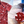 Load image into Gallery viewer, A 3/4 full view of the 7-Strong youth &quot;Smoke Show&quot; button up, a deep maroon red colored shirt with rows of various barbecue and cookout related items and delicacies silhouetted in white. The shirt is displayed against a background of a brisket being pulled. The bottom right features a detail circle showing a close-up of elements in the design. 

