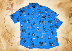 An overlapping full view of the youth and adult 7-Strong "7-Seas" shirt, a bright blue colored shirt with various nautical depictions such as islands, ships, mermaids, etc - drawn in a treasure map like fashion. The shirt is displayed against a weathered treasure map and compass background.