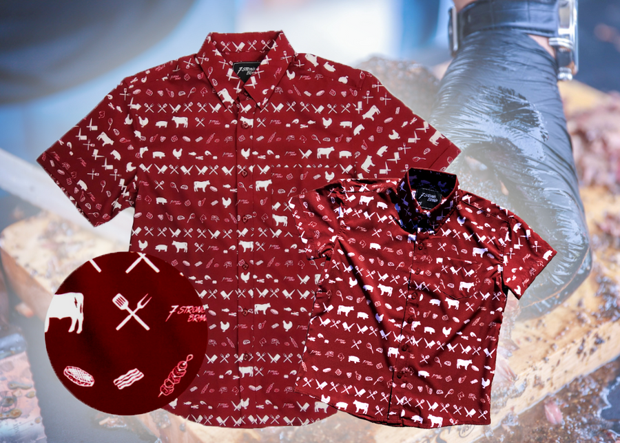 A full view of the 7-Strong youth and adult "Smoke Show" button ups overlapping one another, a deep maroon red colored shirt with rows of various barbecue and cookout related items and delicacies silhouetted in white.The shirt is displayed against a background of a brisket being pulled. The bottom left features a detail circle showing a close-up of elements in the design.